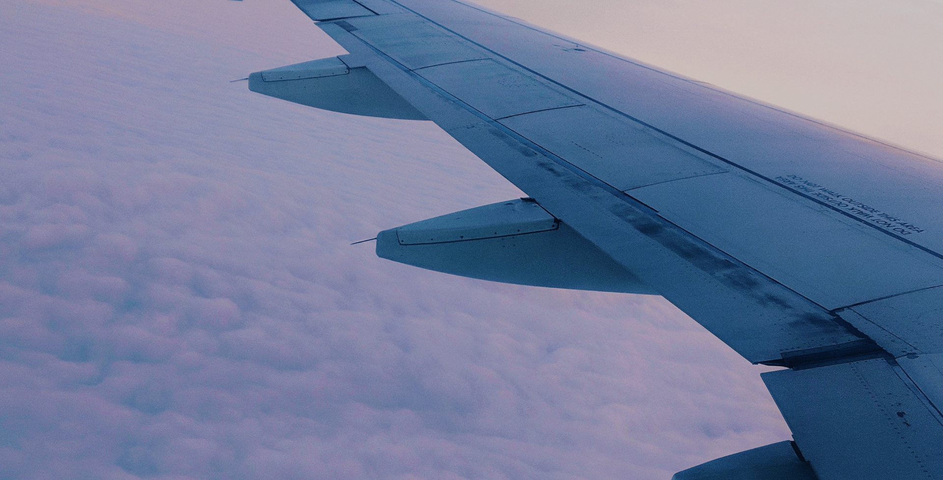 Airplane wing above the clouds